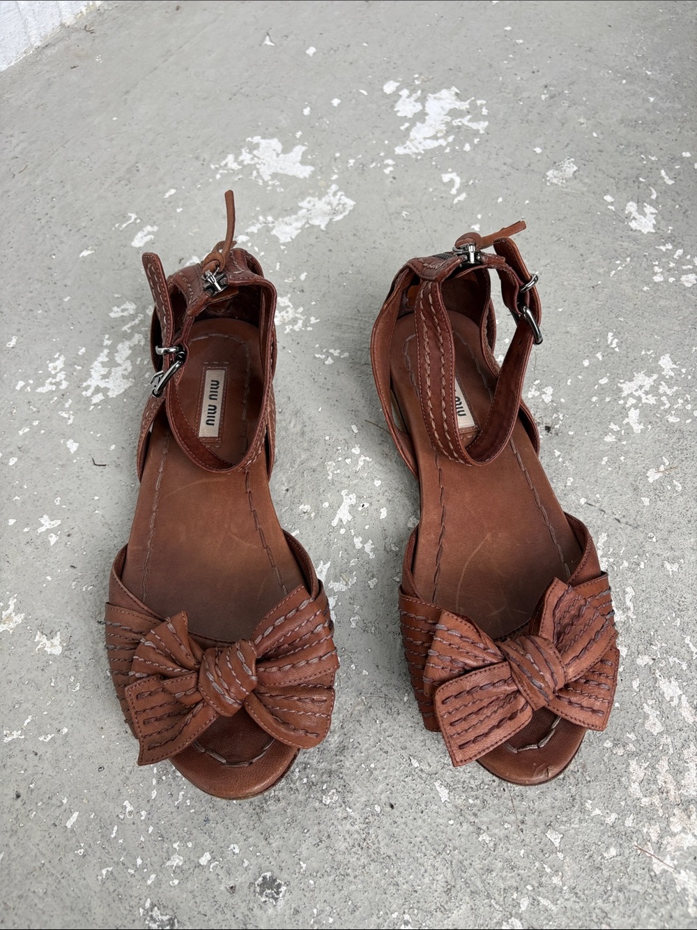 Miu Miu leather bow with ankle straps flat sandals